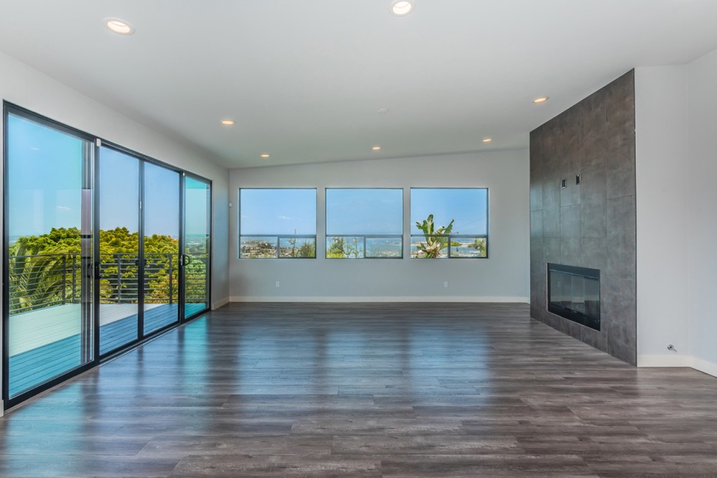 Living room with a fireplace and bay views in a Cresta-managed property